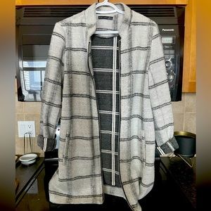 Black Tape Jacket. Colour: white and black plaid. Size: medium.